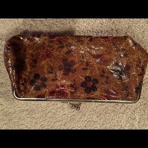 Brown flower clutch’s new condition.